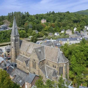 St. Nicholas Church seen from the castle ruins in the city La Roche-en-Ardenne in summer St. Nicholas Church seen from the castle ruins in the city La Roche-en-Ardenne in summer