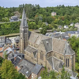 St. Nicholas Church seen from the castle ruins in the city La Roche-en-Ardenne in summer St. Nicholas Church seen from the castle ruins in the city La Roche-en-Ardenne in summer