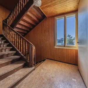 Staircase of a multi-storey residential building built in 1903 in front of demolition work
