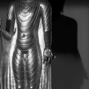 Standing gilded Buddha statue, right hand (raised)