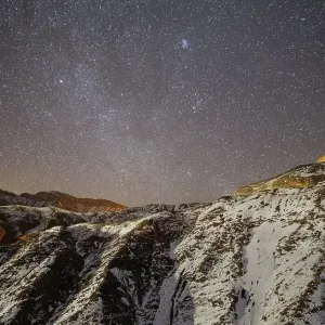 Starry sky over snowy mountains Starry sky over snowy mountains