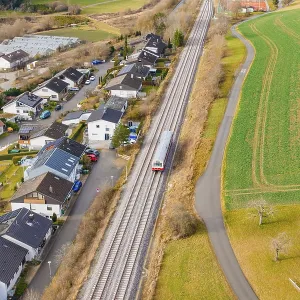 Station on a bend, surrounded by trees and fields near a settlement Station on a bend, surrounded by trees and fields near a settlement