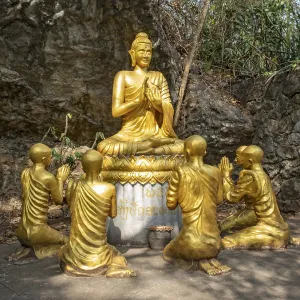 Statue of Buddha teaching disciples