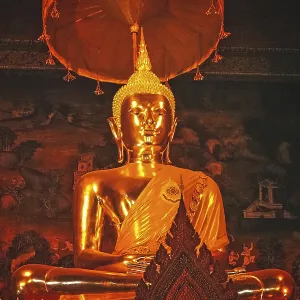Statue of a golden Buddha inside a temple in Bangkok Statue of a golden Buddha inside a temple in Bangkok