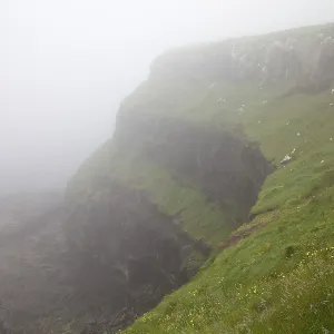 Steep coast in the fog, Vagar, Faroe Islands
