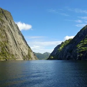 Steep wall of rocks narrow fjord Trollfjorden Lofoten Norway