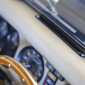 Steering Wheel and Instrument Panel on an Old Classic Car in Switzerland Steering Wheel and Instrument Panel on an Old Classic Car in Switzerland