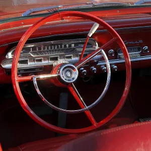 Steering wheel in a vintage car Steering wheel in a vintage car