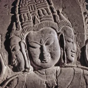 Stone Buddha half-relief with three faces in Nanapaya Temple Stone Buddha half-relief with three faces in Nanapaya Temple