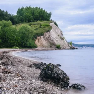 Stone on the riverbank and cliff with birch woodland print Stone on the riverbank and cliff with birch woodland print