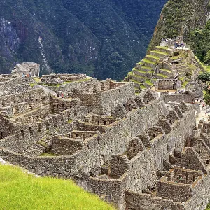 Stone ruins and agricultural terraces in an ancient urban landscape