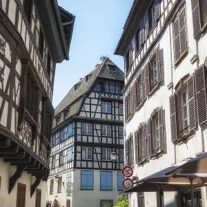 Strasbourg narrow alleyways in historical old town with half timbered houses Strasbourg narrow alleyways in historical old town with half timbered houses
