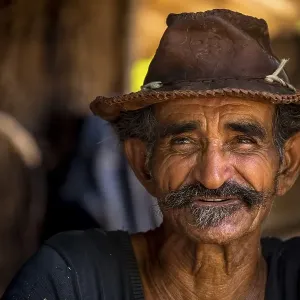 Sugar cane farmer wearing a hat Sugar cane farmer wearing a hat