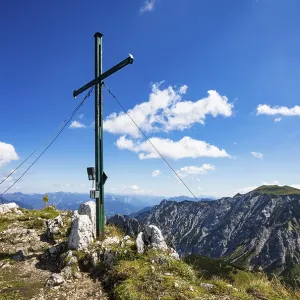 Summit cross on Braunedlkogel with view to Gamsfeld Summit cross on Braunedlkogel with view to Gamsfeld