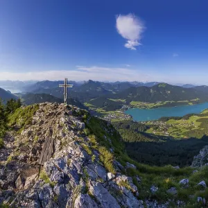 Summit cross on the Frauenkopf with a view of Lake Fuschl Summit cross on the Frauenkopf with a view of Lake Fuschl