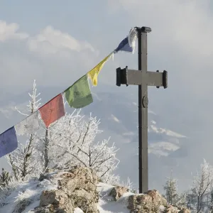 Summit cross with prayer flags Summit cross with prayer flags