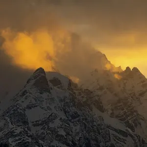 Summit Kleiner and Grosser Bettelwurf with clouds at sunset in winter Summit Kleiner and Grosser Bettelwurf with clouds at sunset in winter