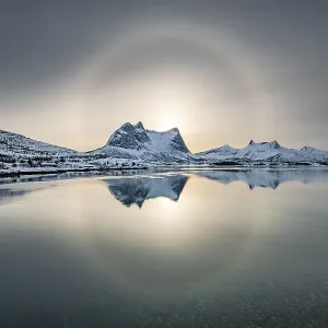Sun ring, halo over snowy mountain range Kulhornet Sun ring, halo over snowy mountain range Kulhornet