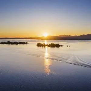 Sunrise, Chiemsee with islands Fraueninsel and Krautinsel