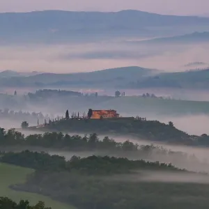 Sunrise with foggy atmosphere in the hilly landscape Sunrise with foggy atmosphere in the hilly landscape