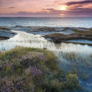Sunset, evening atmosphere at the coastline near Smoegen