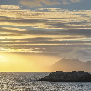 Sunset with golden light above the sea Sunset with golden light above the sea