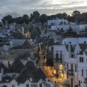 Sunset light over Trulli houses with conical roofs in Alberobello Italy