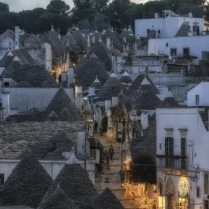Sunset light over Trulli houses with conical roofs in Alberobello Italy