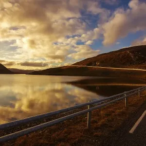 Sunset with lonely road near North Cape