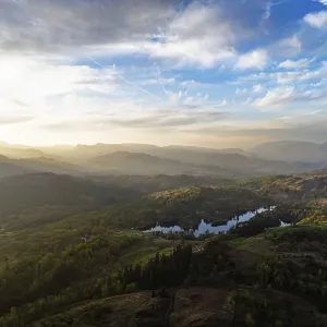 Sunset over Mountains and Coniston Water from drone Sunset over Mountains and Coniston Water from drone