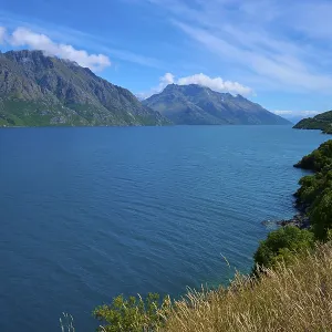 Sweeping views over a tranquil lake nestled in majestic mountains