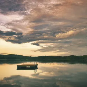 Swimming island in Sweden on a lake at sunset
