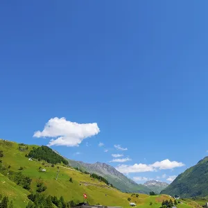 Swiss Alps and Cable Car with Blue Sky in a Sunny Summer Day in Andermatt Swiss Alps and Cable Car with Blue Sky in a Sunny Summer Day in Andermatt