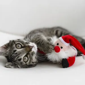 Tabby grey kitten plays with deer Christmas plush toy Tabby grey kitten plays with deer Christmas plush toy