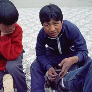 Teenager, young shoe cleaner at work