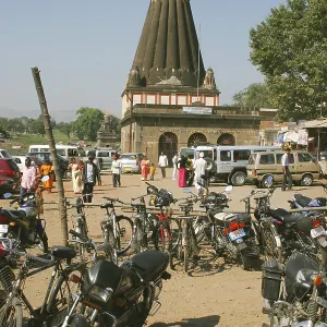 Temple dedicated to lord ganesh named dholu ganpati with bicycles motorcycles and cars in parking lot