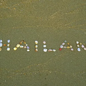 Thailand written with shells in the sand on the island of Ko Lanta Thailand written with shells in the sand on the island of Ko Lanta