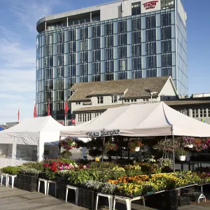Thon Hotel building and market flower stall