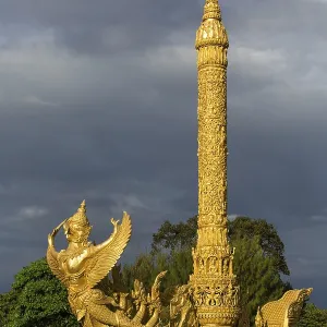 Thung Si Muang Park, Mueang, Garuda figure in front of the Golden Giant Candle Thung Si Muang Park, Mueang, Garuda figure in front of the Golden Giant Candle