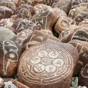 Tibetan Buddhism, Mani stones with Tibetan script Tibetan Buddhism, Mani stones with Tibetan script