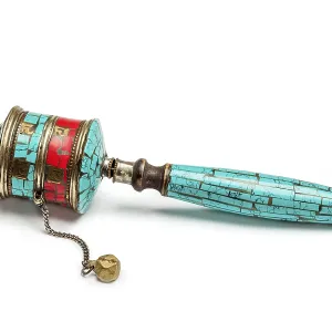 Tibetan buddhist Mani wheel or hand prayer wheel isolated on white
