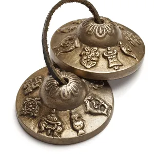 Tibetan Buddhist tingsha cymbals isolated on white Tibetan Buddhist tingsha cymbals isolated on white