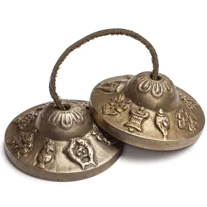 Tibetan Buddhist tingsha cymbals isolated on white