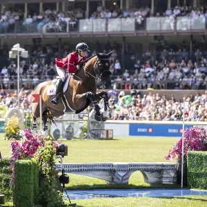 Tiffany Foster of Canada and riding Figor compete in the first round of the 1 Tiffany Foster of Canada and riding Figor compete in the first round of the 1