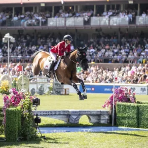 Tiffany Foster of Canada and riding Figor compete in the first round of the 1 Tiffany Foster of Canada and riding Figor compete in the first round of the 1