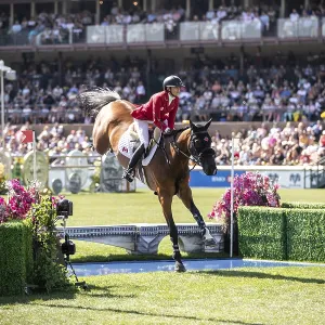 Tiffany Foster of Canada and riding Figor compete in the first round of the 1 Tiffany Foster of Canada and riding Figor compete in the first round of the 1