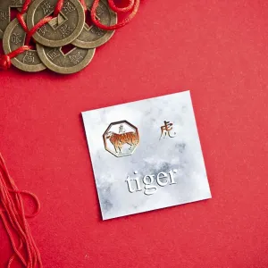 Tiger zodiac card with Chinese character on a red background with coins