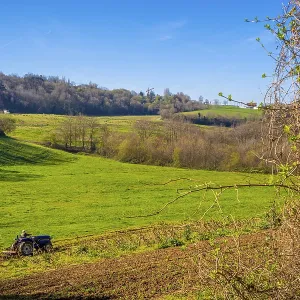 Tilling the land in the mountains of Errenteria with a tractor Tilling the land in the mountains of Errenteria with a tractor