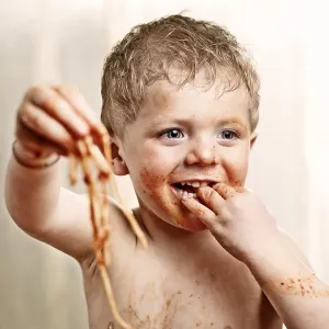 Toddler eating Spaghetti