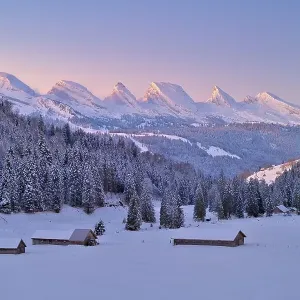 Toggenburg in winter, view of Churfirsten in front of sunrise Toggenburg in winter, view of Churfirsten in front of sunrise